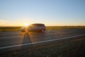 Car driving fast on intercity road at sunset. Highway traffic in evening Royalty Free Stock Photo