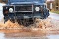 Car Driving Through Flood Water On Road Royalty Free Stock Photo