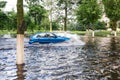 The car driving on a flooded road during a flood caused by heavy rain Royalty Free Stock Photo