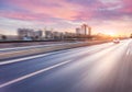 Car driving on freeway at sunset, motion blur