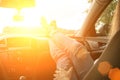 Car driving. Fun driver ride vehicle on road in travel trip. Happy young woman inside car on sunset in summer vacation concept Royalty Free Stock Photo