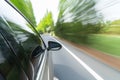 Car driving with green motion blur Royalty Free Stock Photo