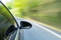 Car driving with green motion blur Royalty Free Stock Photo