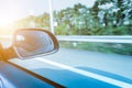 Car driving on the highway sky,side rear-view mirror Royalty Free Stock Photo