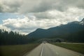 Car driving on a mountain road in green tonnel .Banff National Park, Alberta, Canada,Montain scenic landscape. Bridge for animals Royalty Free Stock Photo