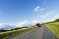 Car driving on a narrow country road Royalty Free Stock Photo