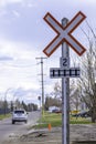 Car driving past railway crossing signal in Industrial park Royalty Free Stock Photo