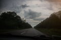 Car driving on the road. Bad grey weather and clouds in the windscreen Royalty Free Stock Photo