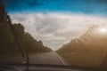 Car driving on the road. Bad grey weather and clouds in the windscreen wipers Royalty Free Stock Photo