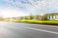 Car driving on road, motion blur