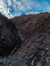 Car driving at rocky slope in Georgia. Road to Ushguli village Upper Svaneti