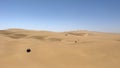 Dune driving in desert. White SUV car off road travel in Africa. Royalty Free Stock Photo