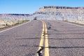 Car driving on scenic state route 24 running through desert in Utah, USA Royalty Free Stock Photo