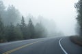 Car Driving Through Thick Fog in Early Morning With Its Fog Lights #2 Royalty Free Stock Photo