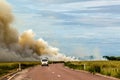 car driving to a controlled Bushfire in Kakadu National Park, with diffrent birds, Northern Territory, Australia Royalty Free Stock Photo