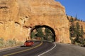 Car driving through tunnel