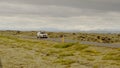 Car driving through volcanic lava fields in south Iceland