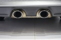 Car dual exhaust pipe. Royalty Free Stock Photo