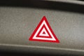 Car emergency attention light button in red triangle Royalty Free Stock Photo