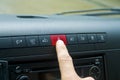 Car emergency button switch, finger press on button switch for turn on flasher light Royalty Free Stock Photo