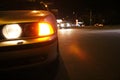 Car emergency lights at roadside in a city