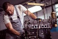 Car engine hanging on hoist Royalty Free Stock Photo