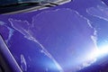 Car engine hood blue used paint faded grunge on front bonnet Royalty Free Stock Photo