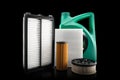 Car engine oil and filters isolated on black background. Car oil, air, fuel filters and motor oil in plastic can isolated. Quality