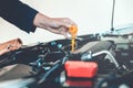 Car Engine oil mechanic working in auto repair service Royalty Free Stock Photo