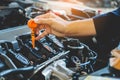 Car Engine oil mechanic working in auto repair service Royalty Free Stock Photo