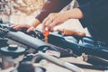 Car Engine oil mechanic working in auto repair service Royalty Free Stock Photo