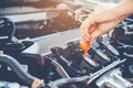 Car Engine oil mechanic working in auto repair service Royalty Free Stock Photo