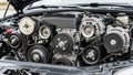 A car engine with an open hood displaying multiple components Royalty Free Stock Photo