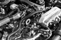 Car engine. Car engine part. Close-up image of an internal combustion engine. Engine detailing in a new car. Car detailing. Black