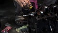 Car engine repair technician oiling to lubricate crankshaft