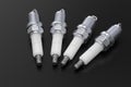 Car engine spark plugs on dark background Royalty Free Stock Photo