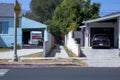 Car entering the garage with the American flag in front of it in Northridge, Los Angeles, California