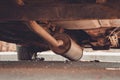 Car exhaust, muffler fallen down - view of chassis of a car Royalty Free Stock Photo