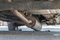 Car exhaust, muffler fallen down - view of chassis of a car