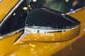 car exhibition new car rear view mirror gold. Royalty Free Stock Photo