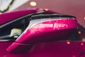 car exhibition new car rear view mirror pink. Royalty Free Stock Photo