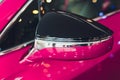 car exhibition new car rear view mirror pink. Royalty Free Stock Photo