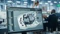 Car Factory Office: Engineer Working on Turbine Prototype on Computer, Design Advanced 3D Model for