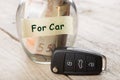 Car finance concept - money glass with word For car and key Royalty Free Stock Photo