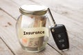 Car finance concept - money glass with word Insurance, car key Royalty Free Stock Photo