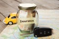 Car finance concept - money glass with word Insurance, car key Royalty Free Stock Photo