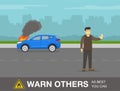 Car fire safety activity. Young driver warns others to stay away and be careful. Royalty Free Stock Photo