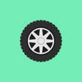 Car flat wheel with tire vector icon on green background