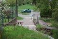 A car on a flooded meadow near a watercourse