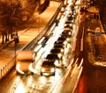 Car flow in traffic in the evening in the city. The view from the top. Shooting on a long exposure. Royalty Free Stock Photo